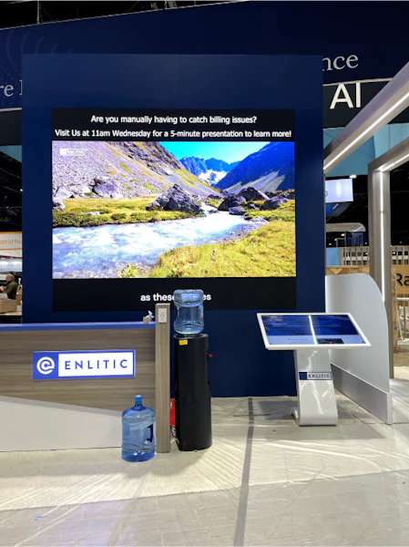 enlitic booth with digital signage